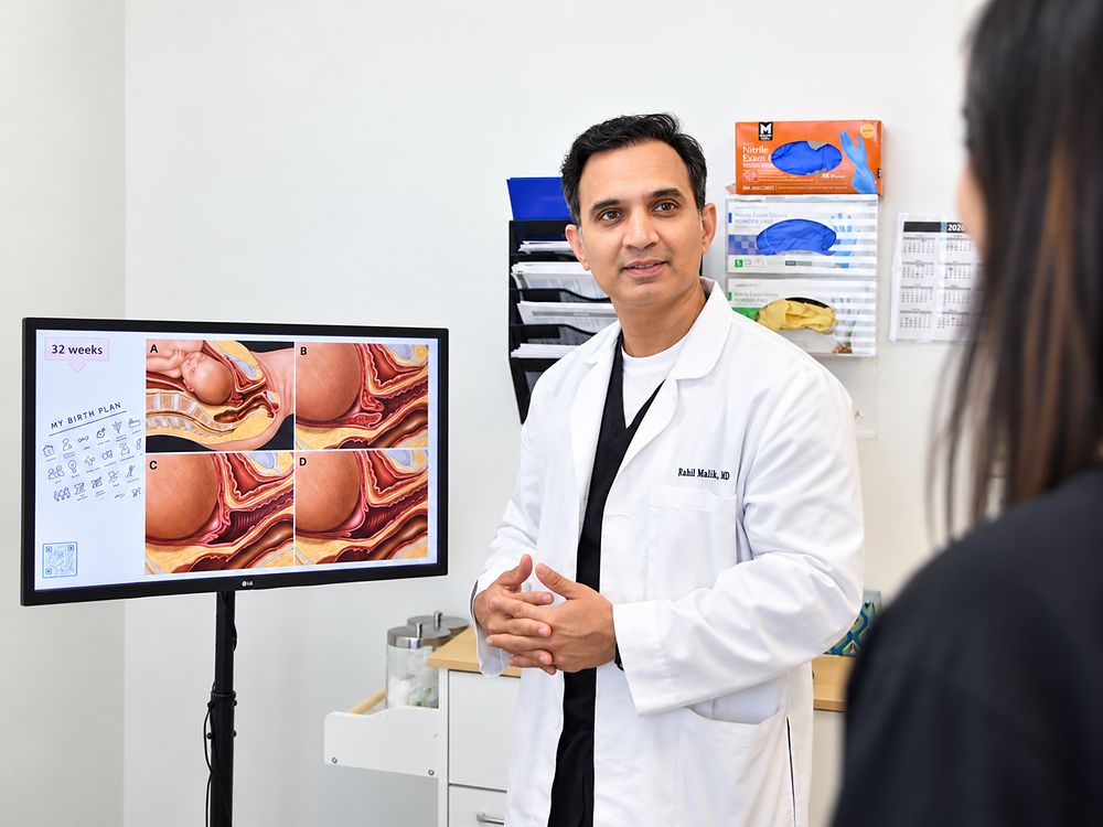 Dr. Malik reviewing a birth plan and stages of labor with a patient